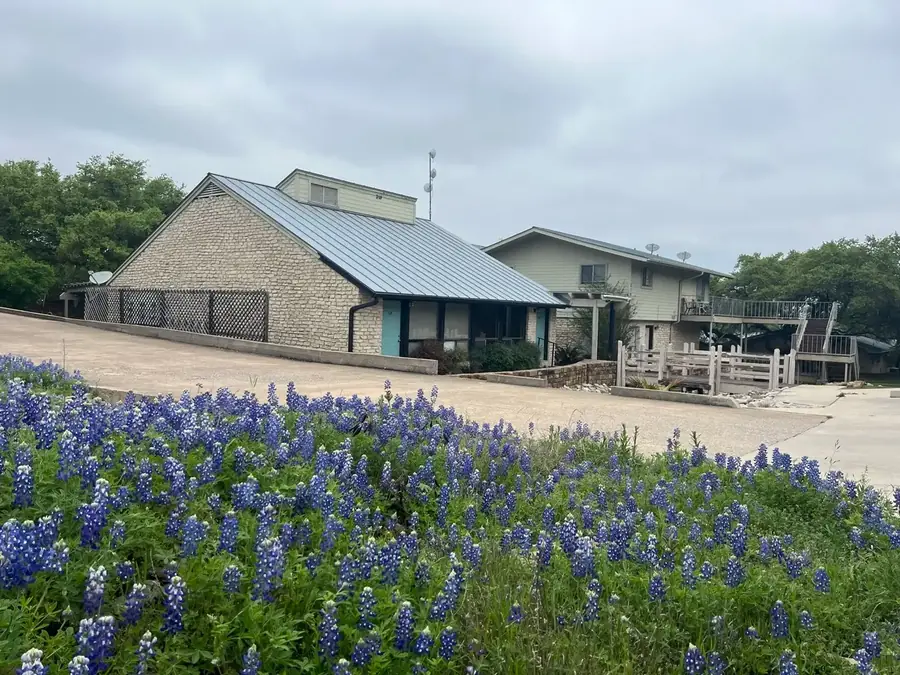 Texas bluebonnets in bloom in front of Baycliff Apartments in spring