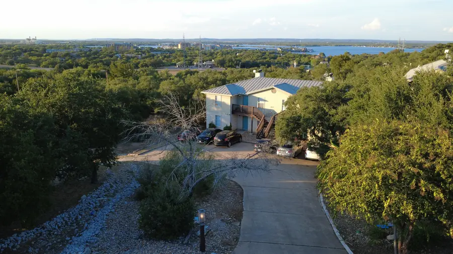 Baycliff apartment building with panoramic Lake LBJ view beyond