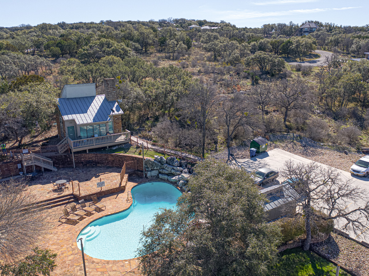 Aerial view of Baycliff pool, stone patio, and BBQ gazebo