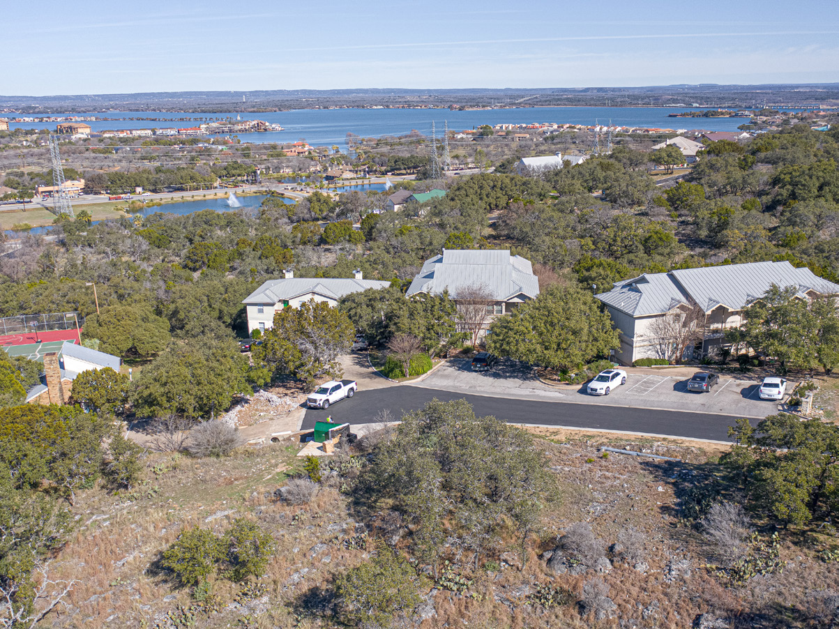 Aerial drone view of Baycliff Apartments with Lake LBJ in background