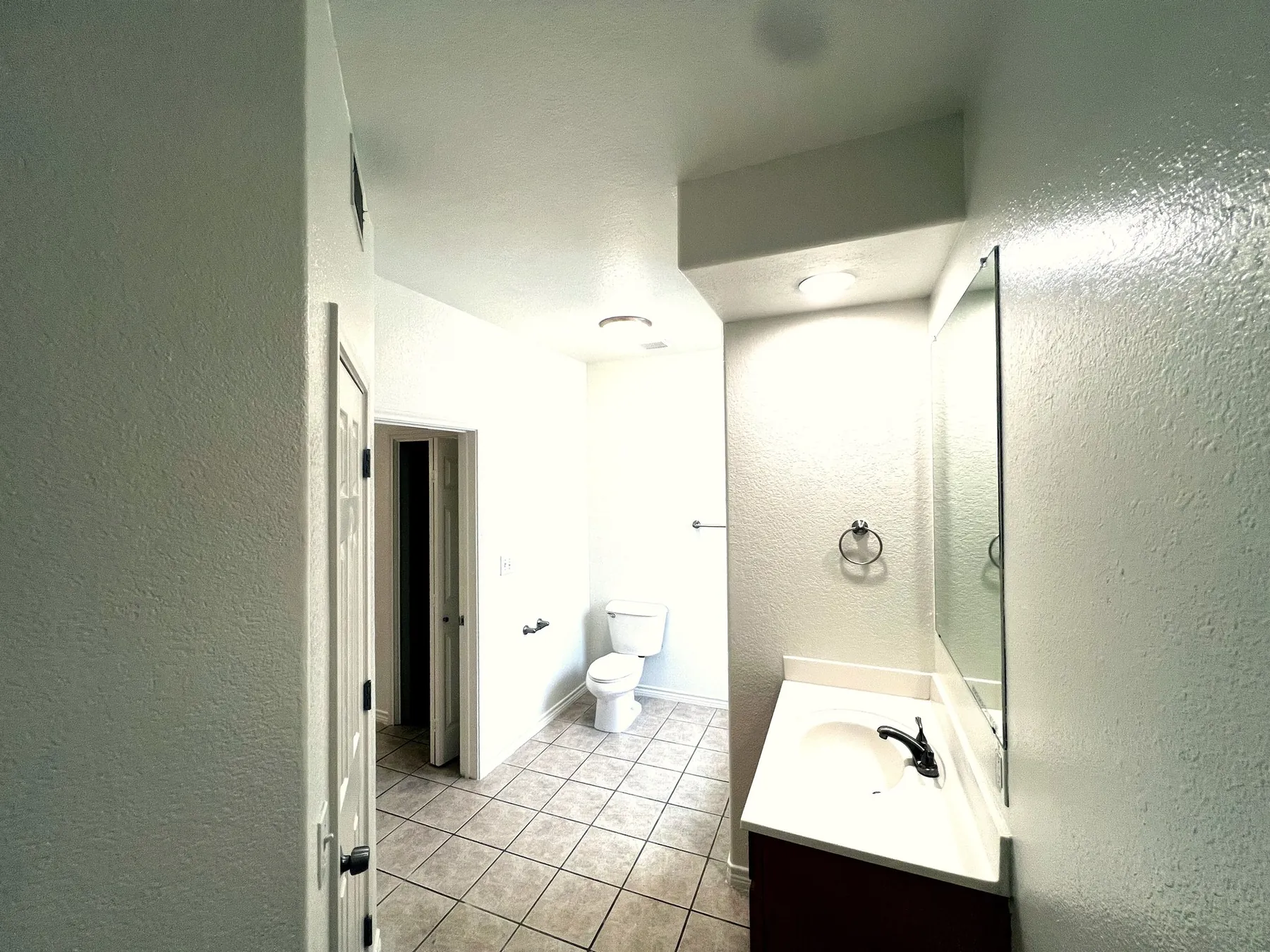 The Pecan – bathroom with soaking tub and glass block window, Baycliff Apartments Horseshoe Bay TX