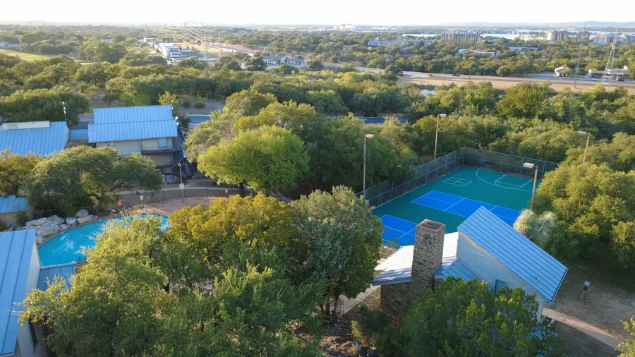 Baycliff pool and pickleball courts with Lake LBJ visible on the horizon
