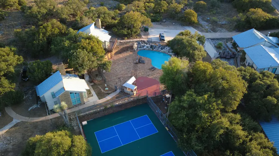 Aerial of Baycliff pool, sport courts and apartment buildings in the Hill Country
