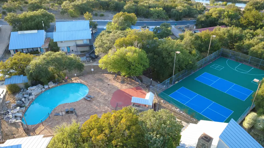 Aerial view of Baycliff pool, stone patio, and BBQ gazebo
