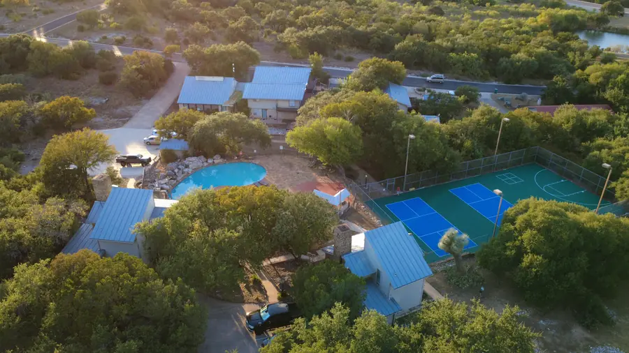 Full aerial overview of Baycliff Apartments showing pool, courts and all buildings